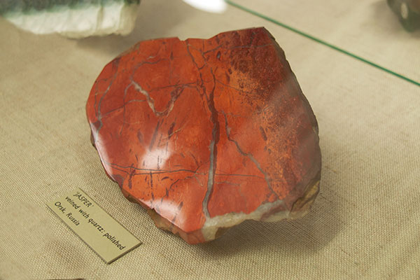 Red Jasper | Stone Mania red jasper stone in a museum display cabinet