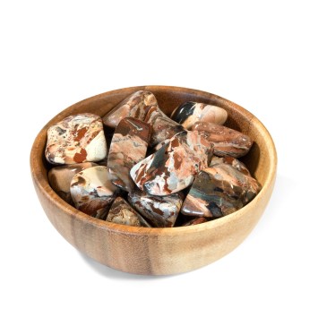 highly polished jasper tumbled stones in a small wooden bowl